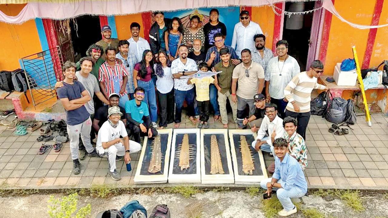 The students pose with the rostrum of the sawfish. PIC COURTESY/@pradippatade