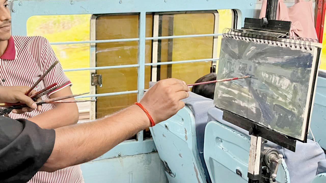 Sachin Banne works on the canvas in the train. Pics courtesy/Sachin Banne