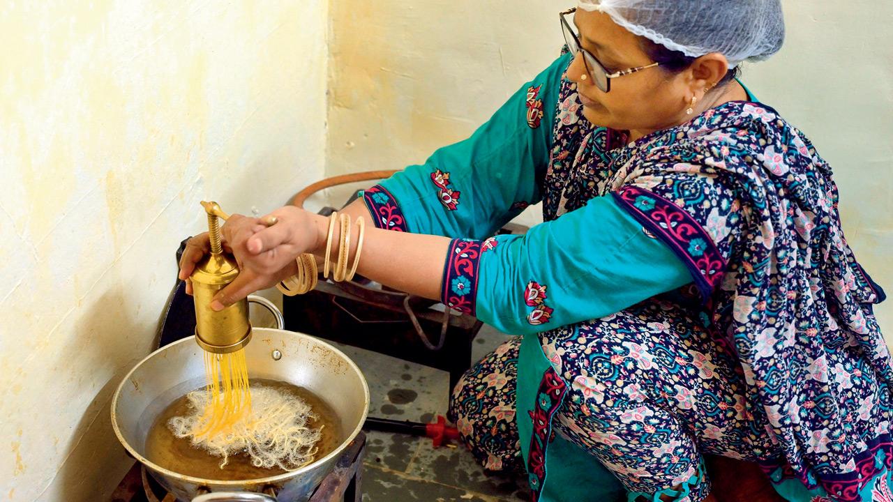 Hamida Shaikh prepares sev in the kitchen 