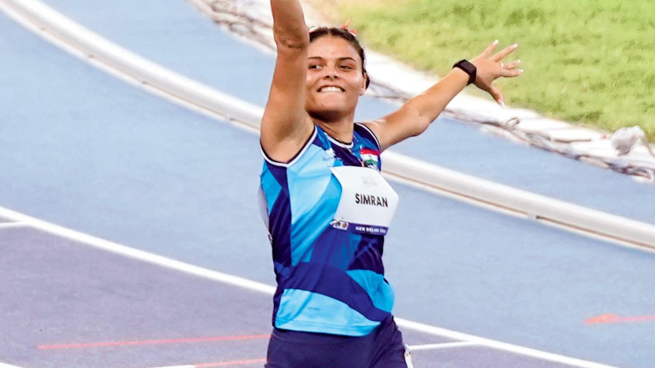 An ecstatic Simran Sharma after winning the T12 100m race