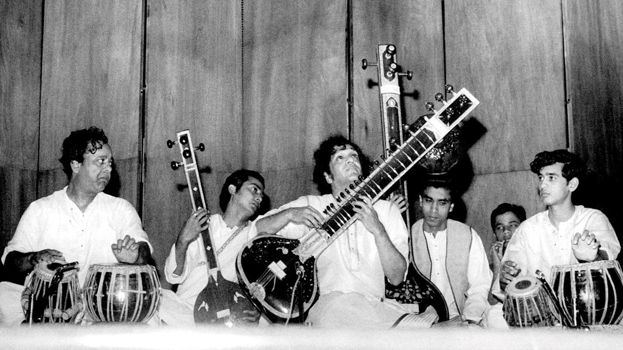 A dated photograph of (from left) Ustad Alla Rakha, Pandit Ravi Shankar and Zakir Hussain onstage at the Nariman Point venue