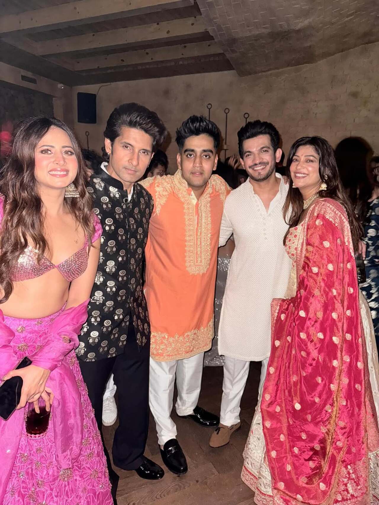 Sargun Mehta dazzles in a pretty pink lehenga while Ravie Dubey picks the classic black kurta