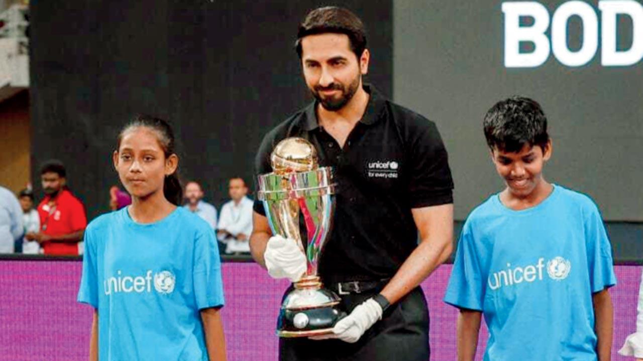 Bollywood actor Ayushmann Khurrana with the ICC Women’s World Cup trophy at the DY Patil Stadium on Sunday. Pic/UNICEF, ICC