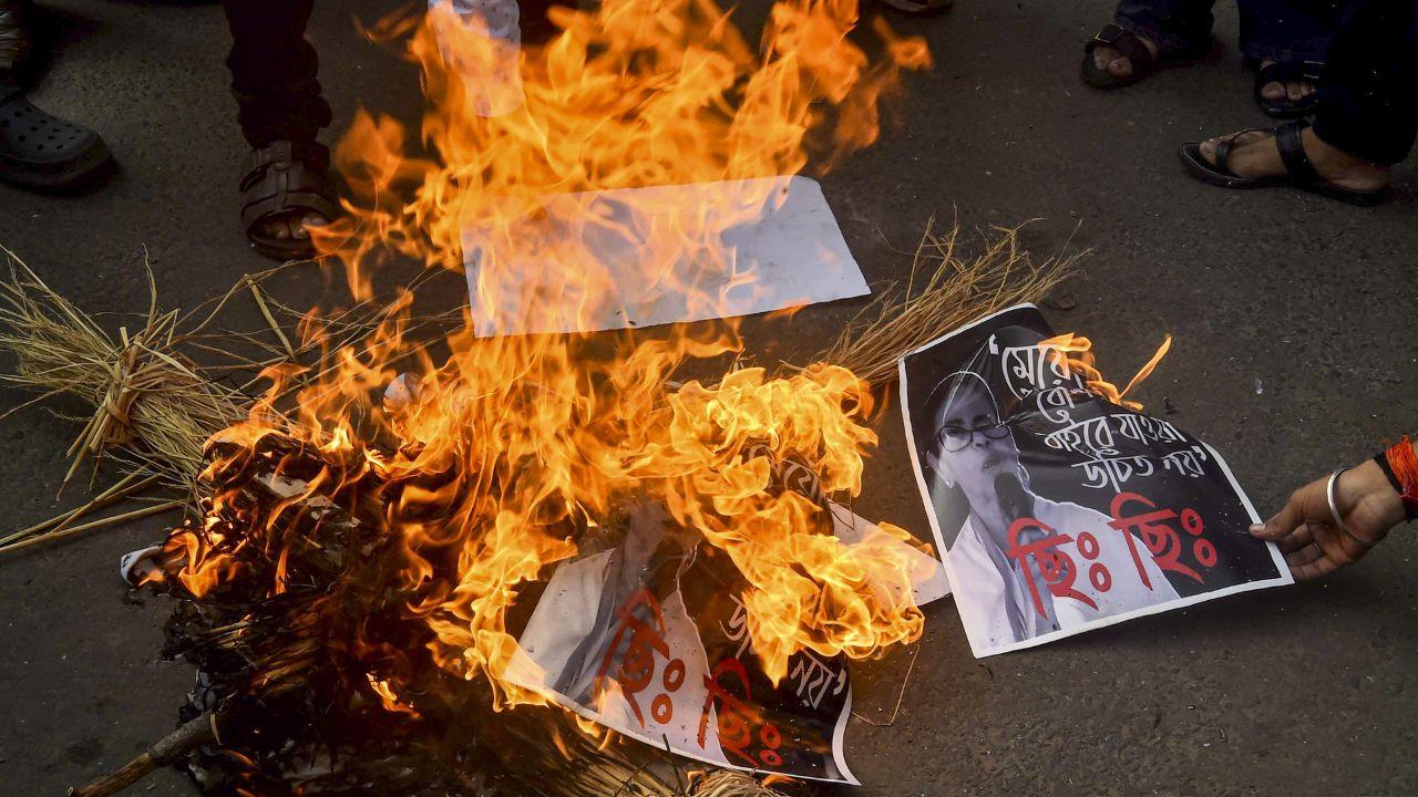 Members of Akhil Bharatiya Vidyarthi Parishad burn an effigy during a protest over the alleged rape of a medical student in West Bengal's Durgapur
