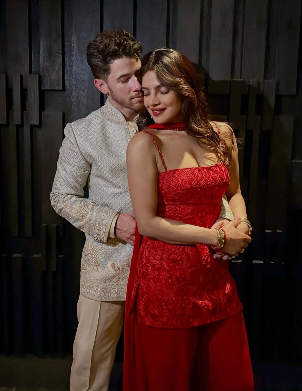 Soaked in love with that red attire, Priyanka picks a modern yet desi outfit for the celebration