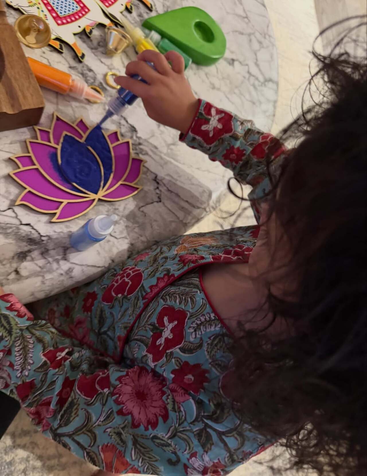 Malti is acing the rangolis with mom for the Diwali decor