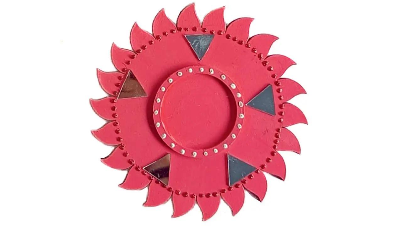 Reuse previous decorSharma advises using cardboard cutouts to make round bases for candle or diya holders. Paint and embellish these, with beads or pieces of mirror work. These can often be found on other already-existing or previously used decorations or even on rakhis, Sharma points out. Instead of disposing of older decor, reusing them to create new items proves both eco-friendly and budget-friendly. 
Get messyDitch traditional rangolis, with the usual colours purchased from the market,  and make use of any intact cake base at home by painting it in any style of rangoli of your choice. Get as creative as you want; use clay to make figurines or other items such as flowers, to add on to the rangoli decor as well.