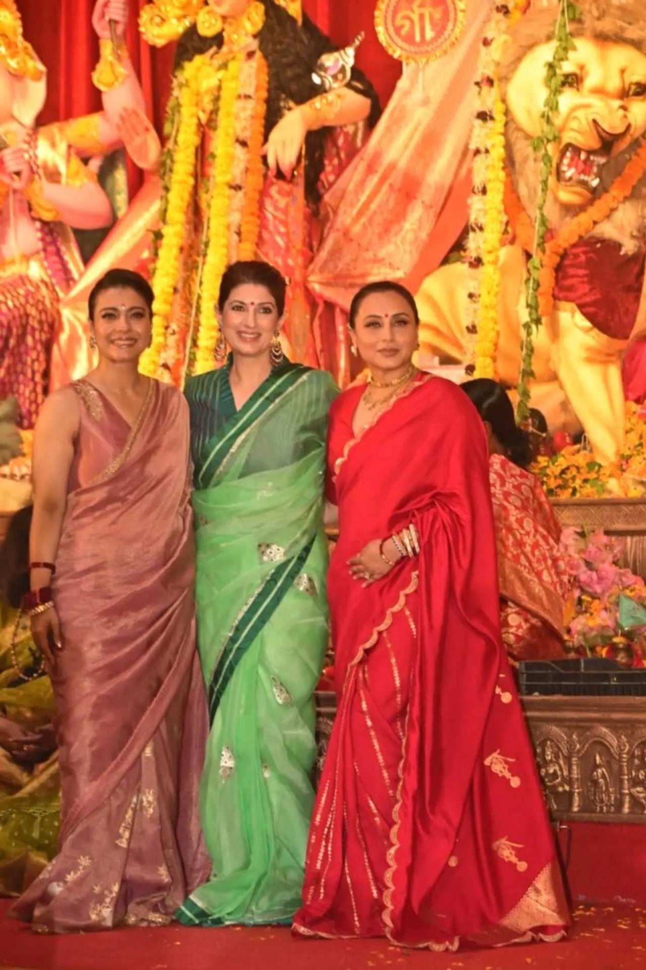 Twinkle Khanna goes for a tissue silk green saree as she poses with Rani and Kajol