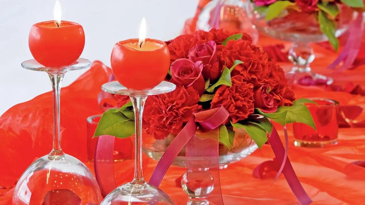 DIY with kitchenwareFor those seeking a time-friendly option to light up your hall, use drinking water glasses as candle holders, by filling them with flowers, turning them upside-down, and placing a small candle on top of each.