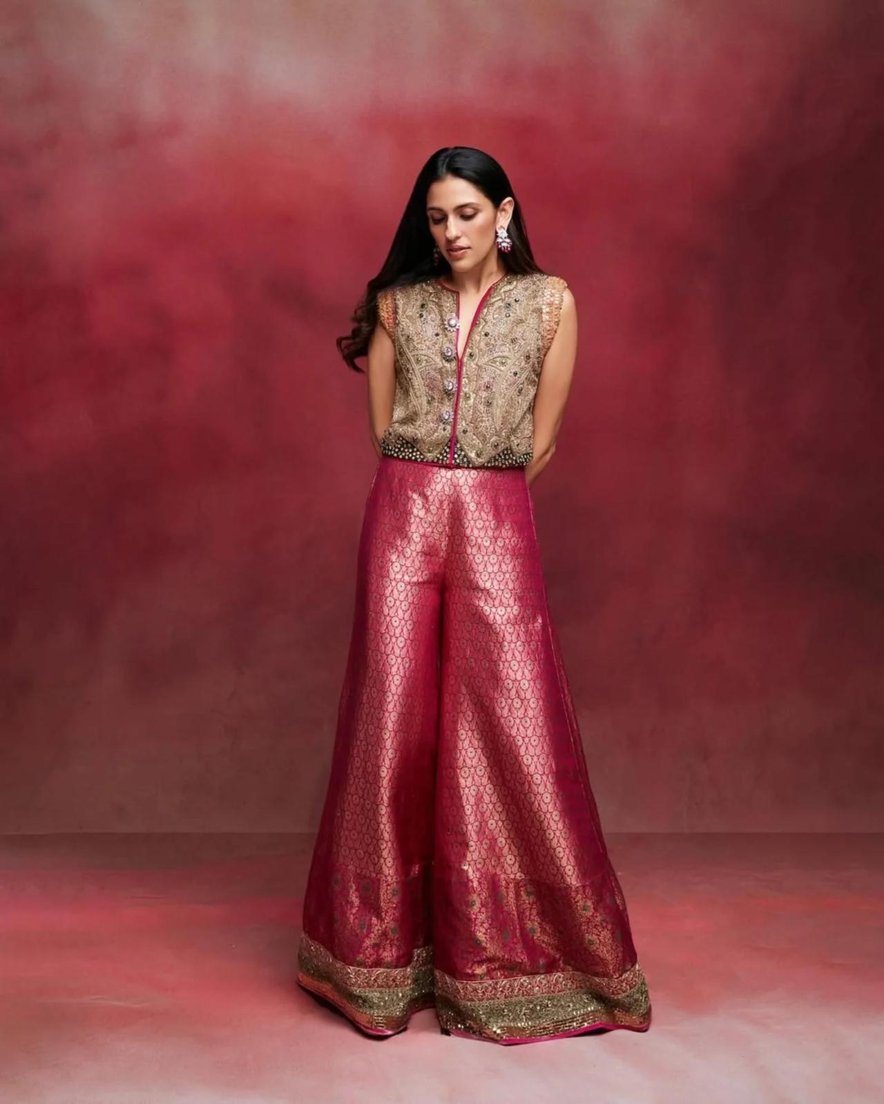 It was paired with handcrafted brocade sharara pants with zari borders. The pink sharara perfectly complemented the jacket.