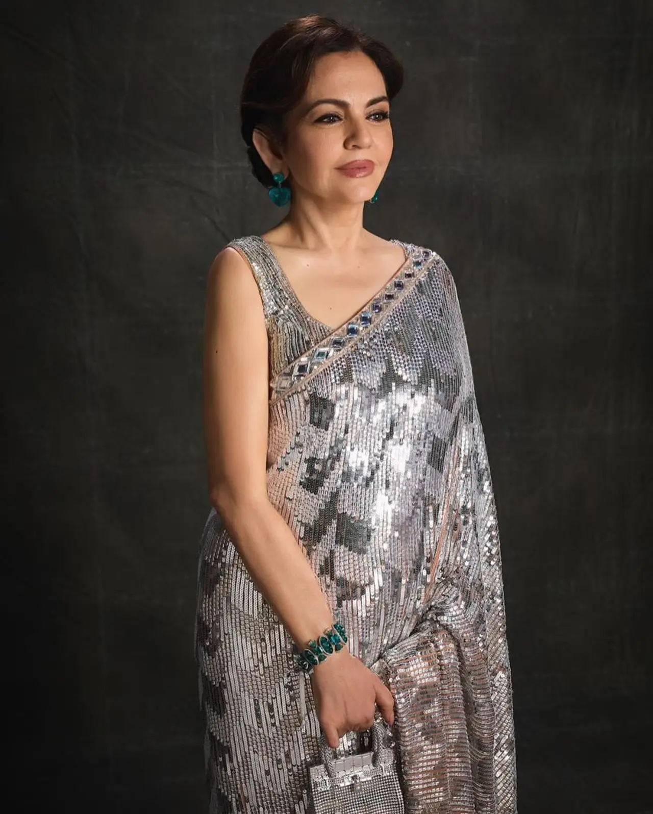 She completed the look with a special edition miniature Birkin from the exclusive High Jewelry collection by Hermès.