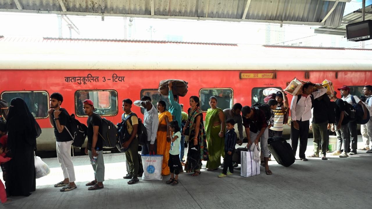 Station staffers were seen working to manage the flow of passengers and ensure safety amid the busy situation