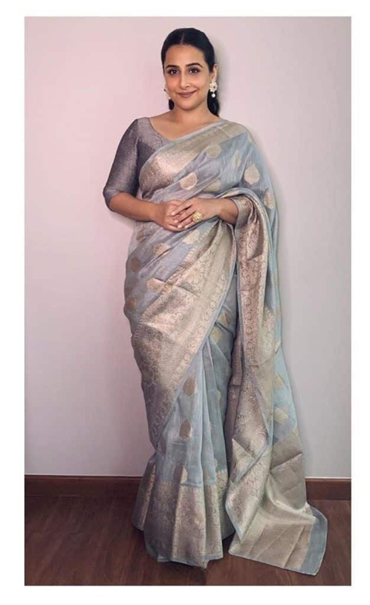Vidya Balan looks ethereal in this gorgeous grey silk saree with gold zari work. 