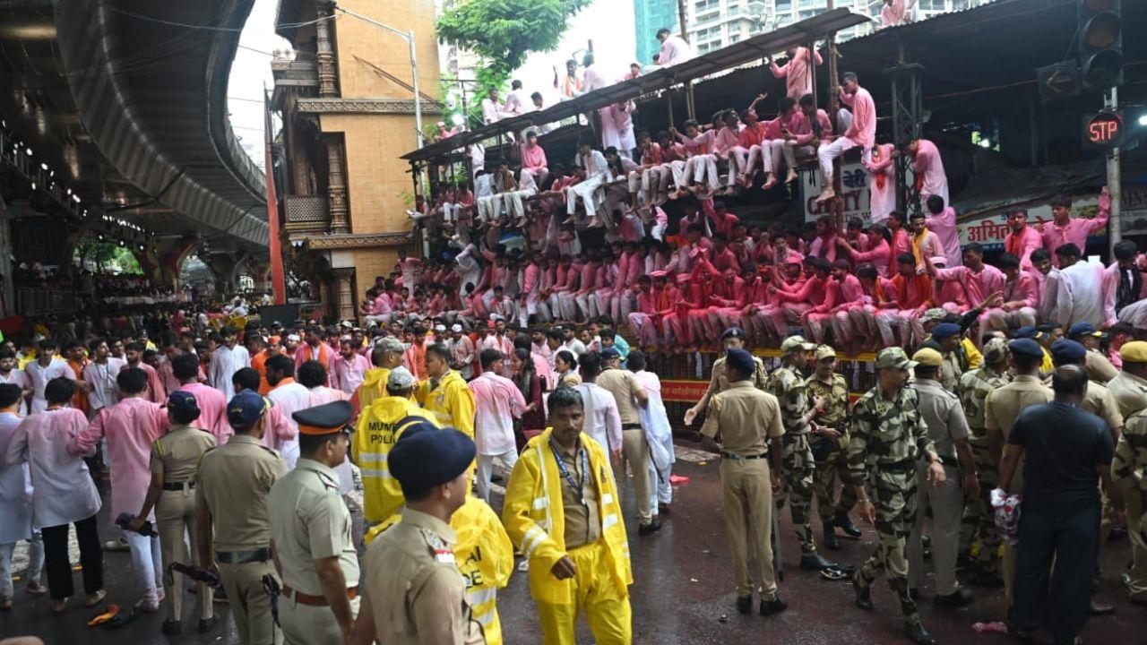 The faithful stand with eyes filled with devotion, awaiting a glimpse of Mumbai’s beloved Ganpati, Lalbaughcha Raja.