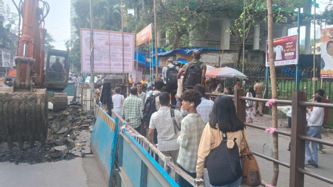 Heavy drilling and repair work are underway, forcing walkers to squeeze through narrow pathways. (Pic/Sayeed Sameer Abedi)