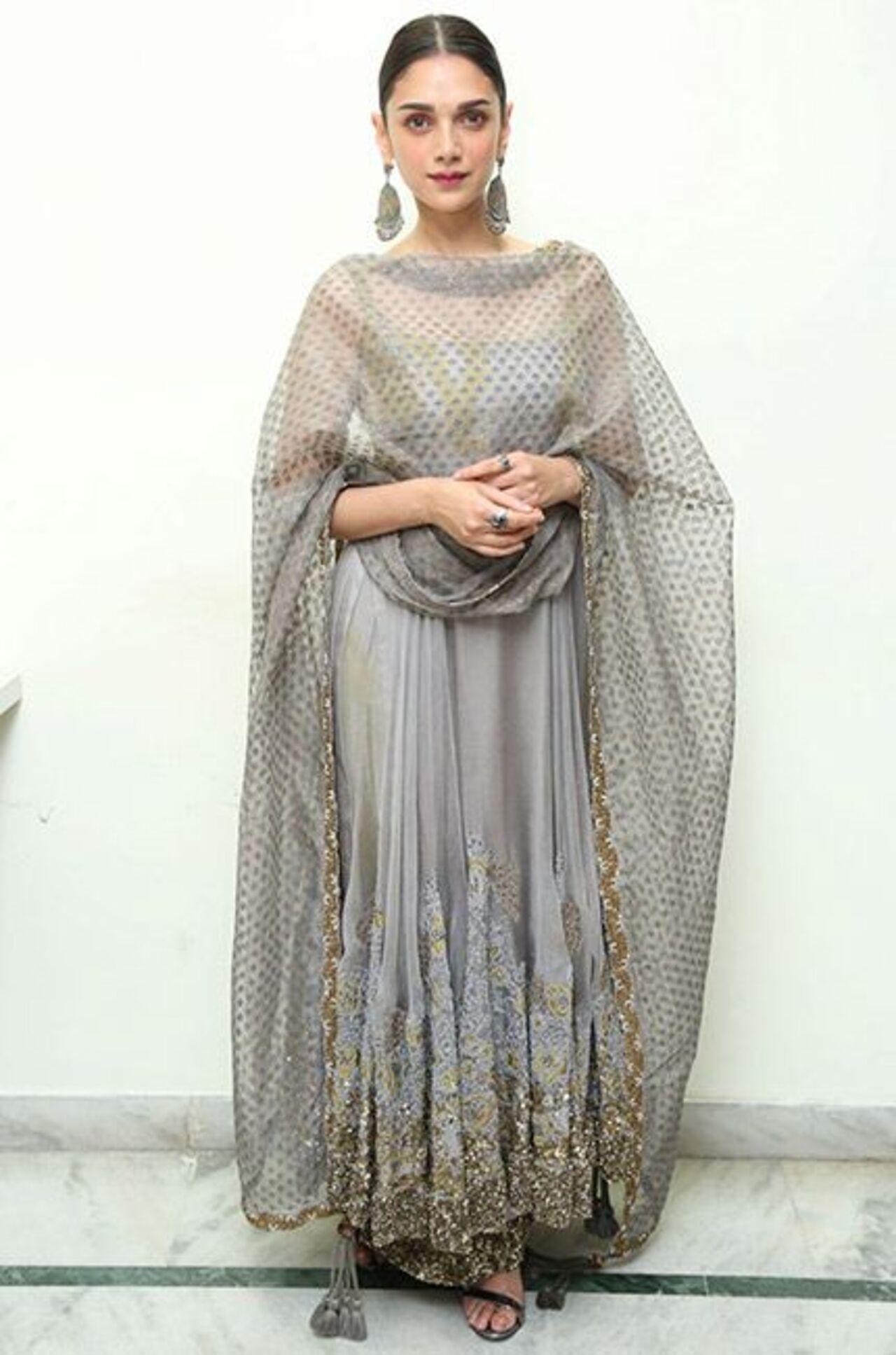 Aditi Rao Hydari looks royal in this grey anarkali set, which features golden embroidered work with a sheer net dupatta.