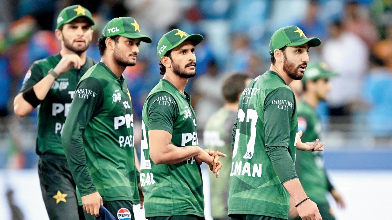 Pakistan captain Salman Agha (right) reacts as India players walk back to the pavilion without a handshake after their win on Sunday. Pic/AFP