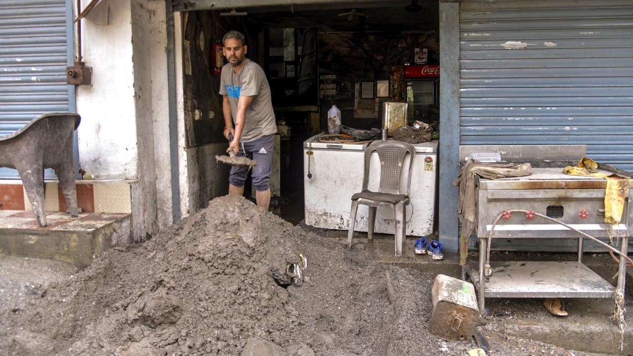 On Tuesday, torrential rains lashed Dehradun districts, causing the Sahastradhara river to overflow. The gushing waters carried debris into the main market area, leading to significant damage to several commercial establishments