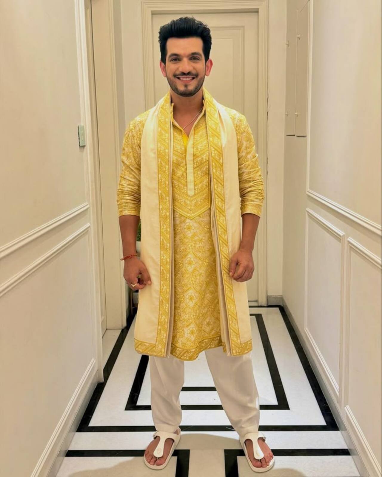 Arjun Bijlani looked dapper in this yellow kurta with white pyjama pants and a white stole featuring yellow borders.