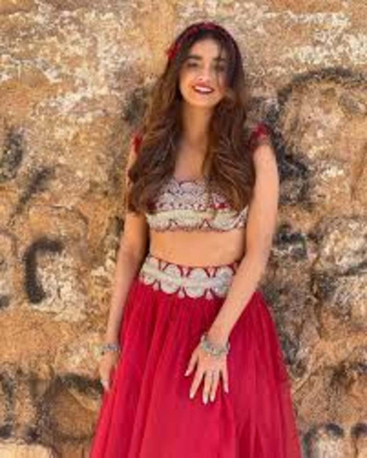 Dress up like a showstopper, just like Keerthy Suresh, in a stunning red lehenga adorned with silver embellishments