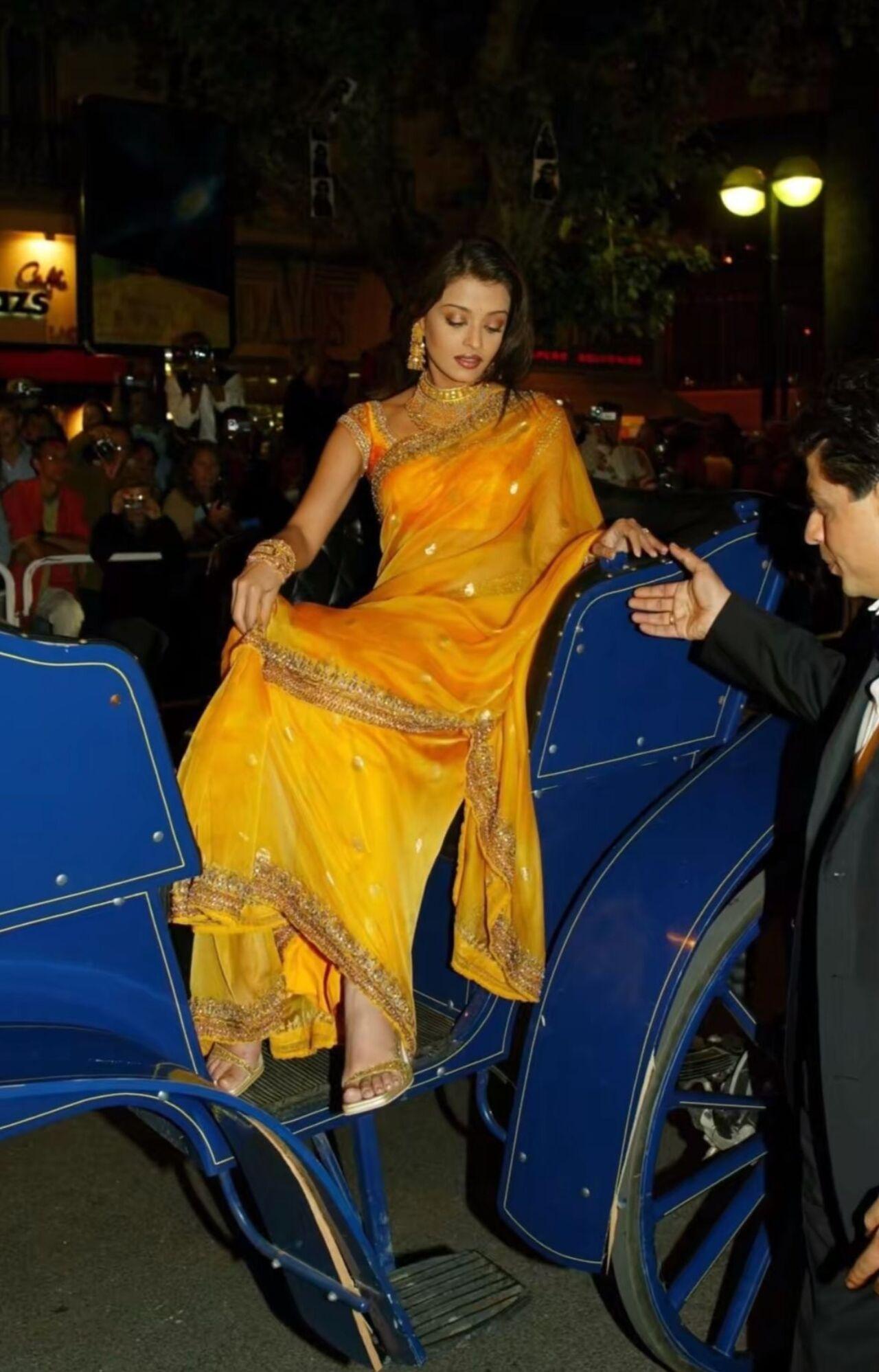 Keeping it traditional, Aishwarya Rai shines bright in this yellow saree with a golden border. She completed the look with traditional kundan jewellery and a striking eye-makeup.