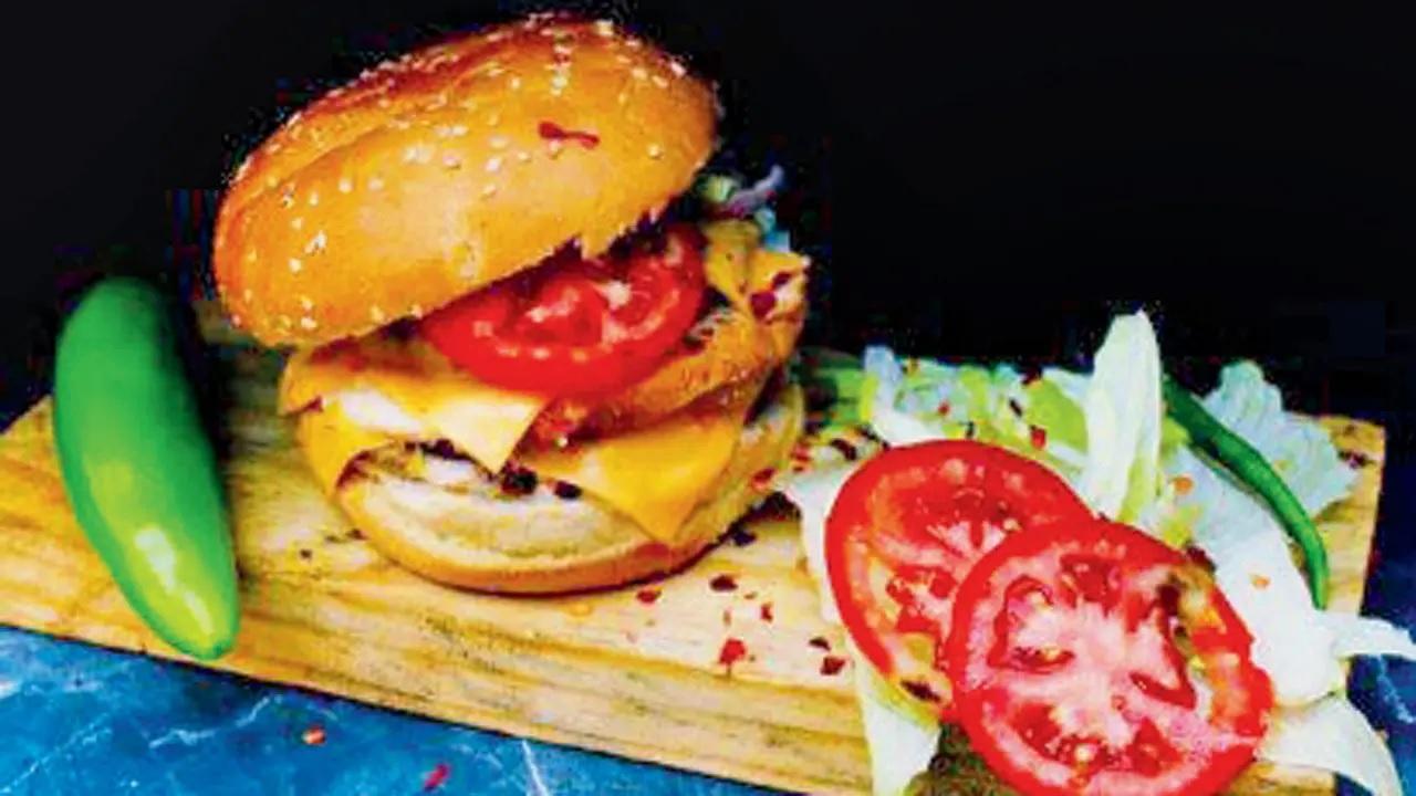 Flavours in houseGet your quick fix with a good old Chicken Cheese Burger at this sweet spot.
At The Burger House, Sanpada, Navi Mumbai.Call 9137825728 Cost Rs 70