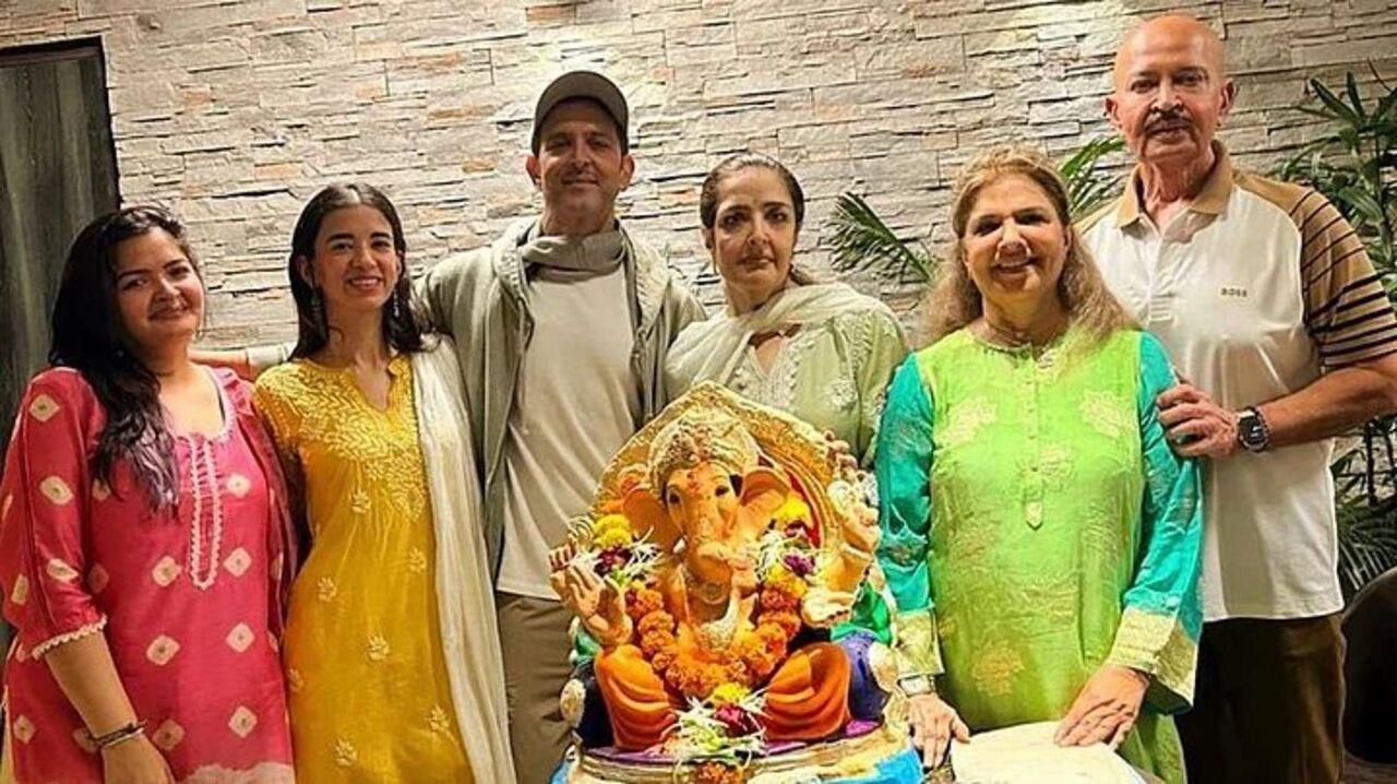 The family is seen happily posing alongside an idol of Lord Ganesha from the Ganpati festivities. 