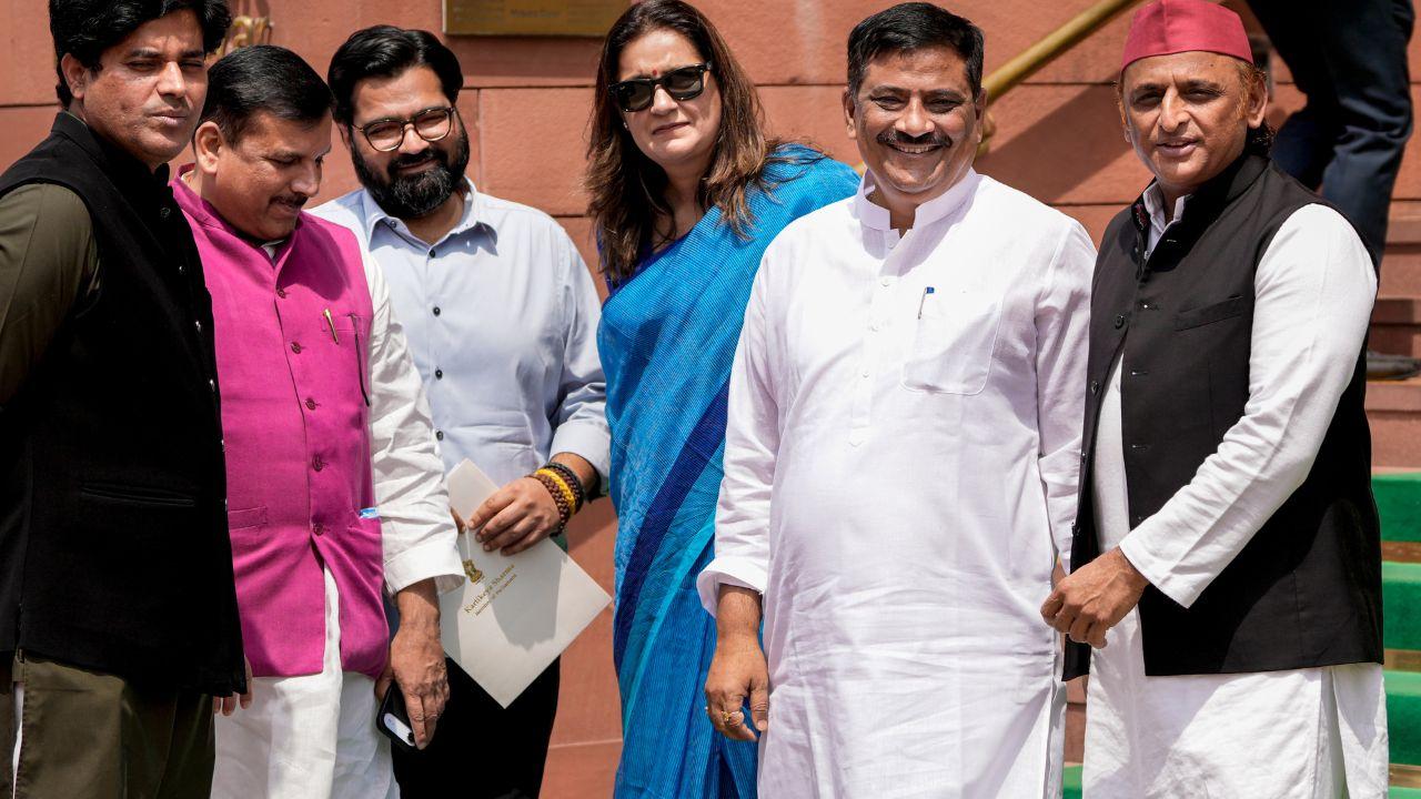 Congress MP Imran Pratapgarhi, left, AAP MP Sanjay Singh, second left, Shiv Sena (UBT) MP Priyanka Chaturvedi, third right, JD(U) MP Sanjay Kumar Jha, second right, Samajwadi Party (SP) MP Akhilesh Yadav, right, and others during the Parliament Session