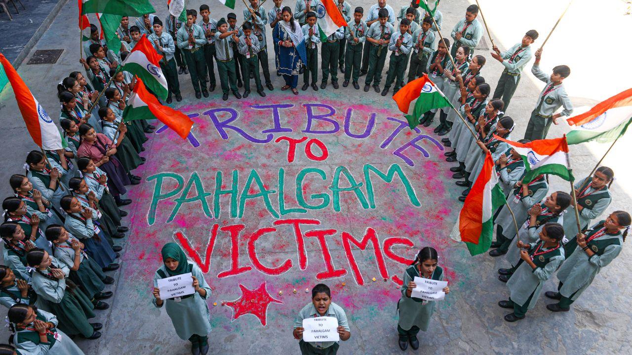 Young students create a rangoli tribute, using art to remember the victims and keep their memory alive