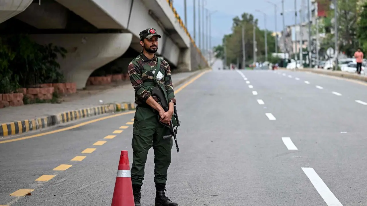 Army personnel maintain a strict vigil on closed roads in the capital, reflecting the high stakes surrounding the diplomatic engagements