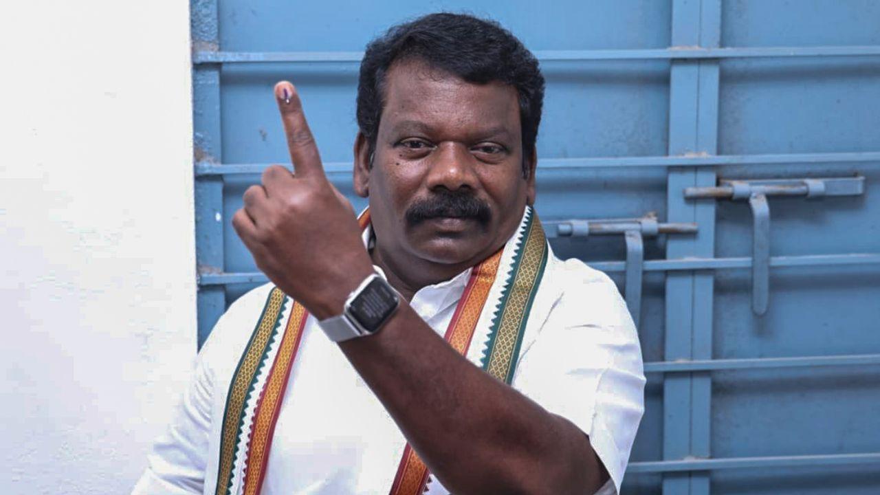 Tamil Nadu Congress Committee (TNCC) President and party candidate for Sriperumbudur constituency, K Selvaperunthagai, shows his ink-marked finger after casting his vote for the Tamil Nadu Assembly elections