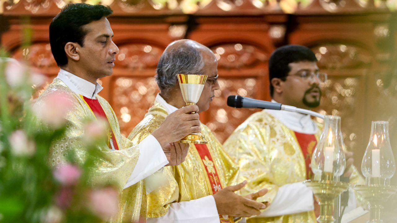 Bishops carried flickering candles during the midnight service, where the Paschal candle was lit, symbolising Christ&rsquo;s resurrection