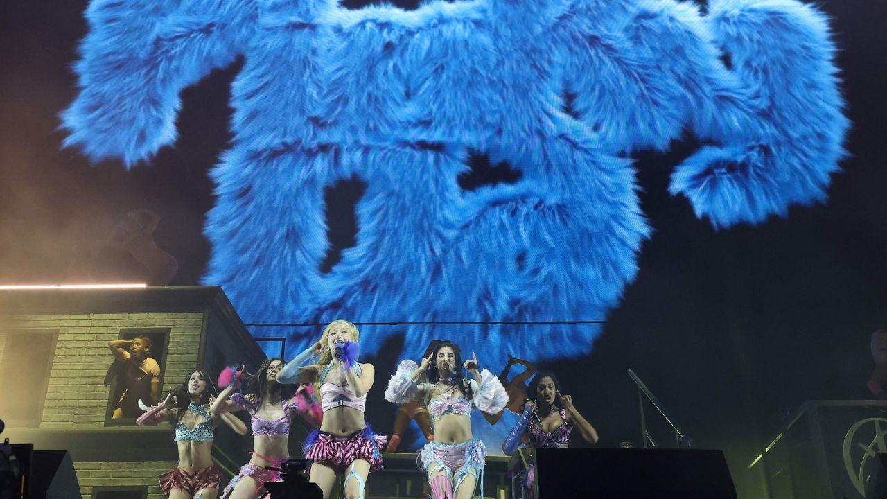 Girl group Katseye performs on stage, showcasing pop energy and choreography at the global music event