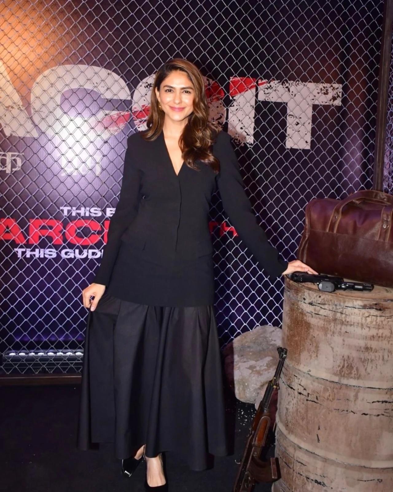 Mrunal Thakur exudes boss lady energy for the Dacoit promotions in this sophisticated all-black ensemble. She pairs a sleek, structured blazer featuring a sharp V-neckline with a voluminous, floor-length flared skirt.