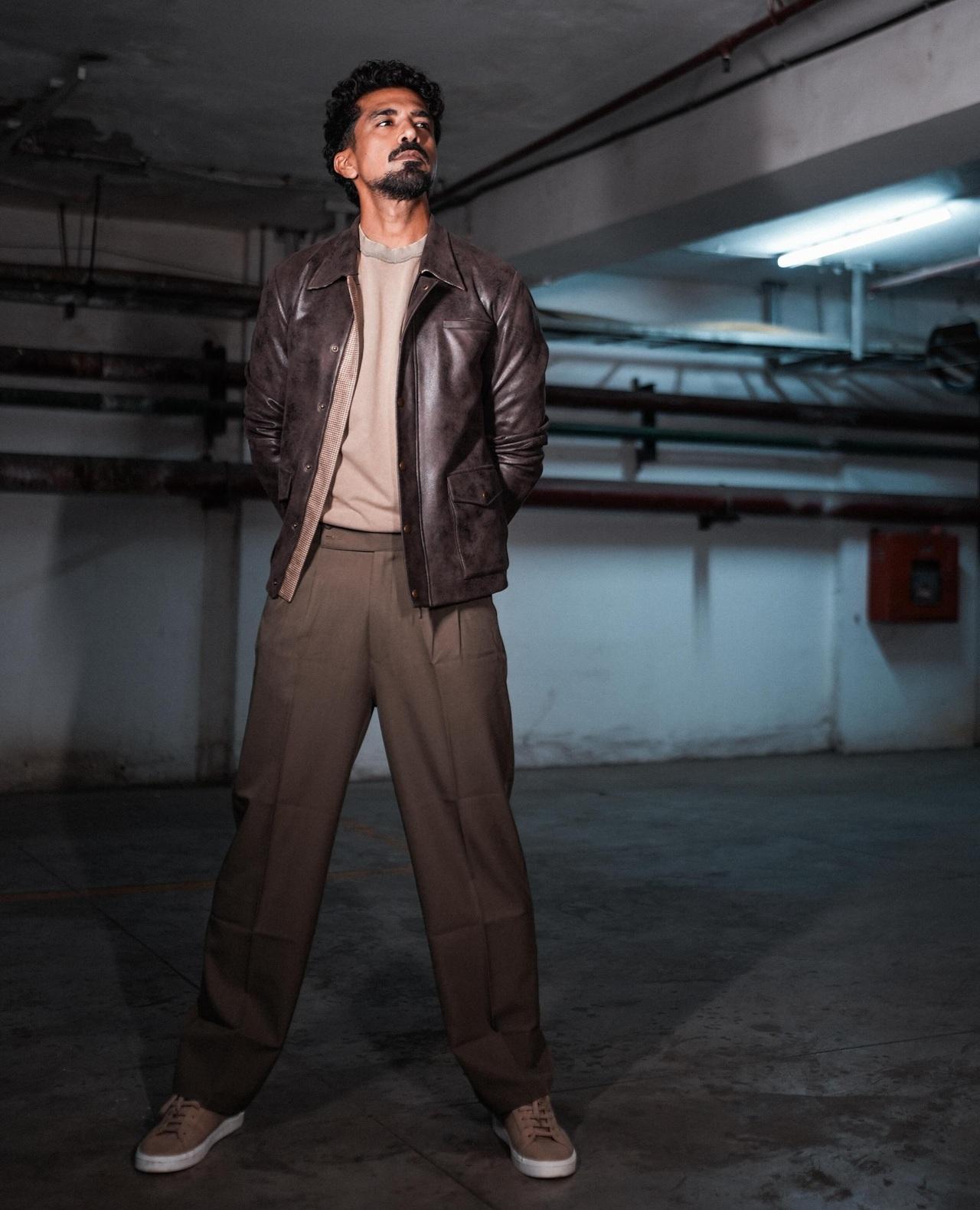 Saqib Saleem shows how to bring subtle energy in muted tones by donning a brown leather jacket over a beige tank.