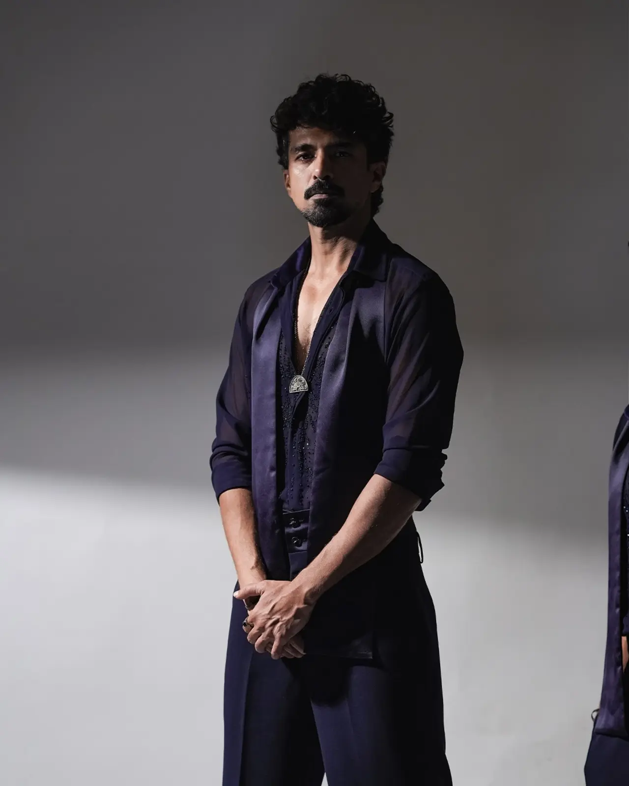 Saqib Saleem brought a dash of vibrancy in a deep purple outfit, featuring a sheer shirt with embellished details and netted sleeves.&nbsp;