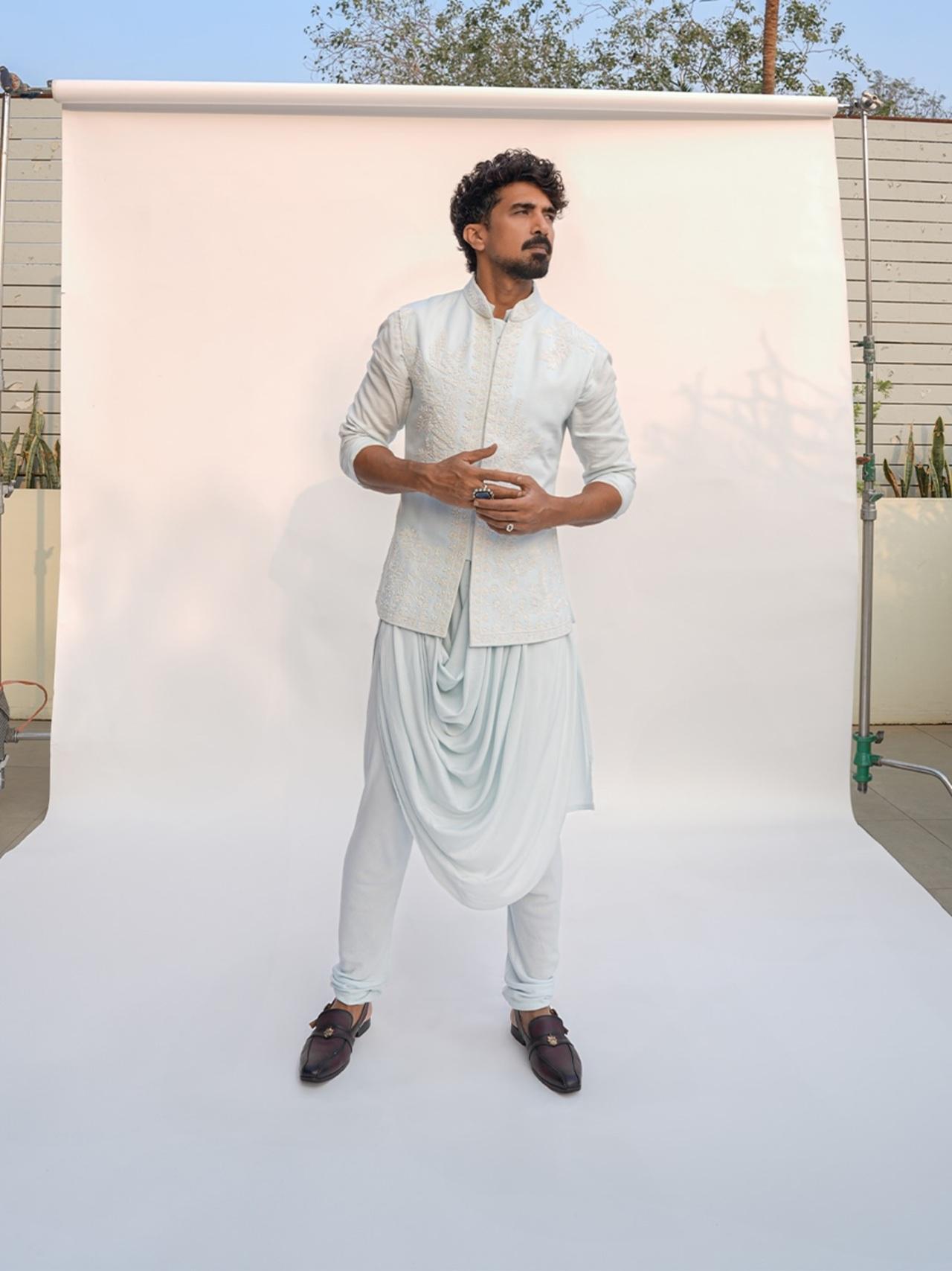 Saqib Saleem looks straight out of a royal frame in a light blue, textured kurta with chudidar and layers his kurta with an embroidered, bandhgala jacket.&nbsp;