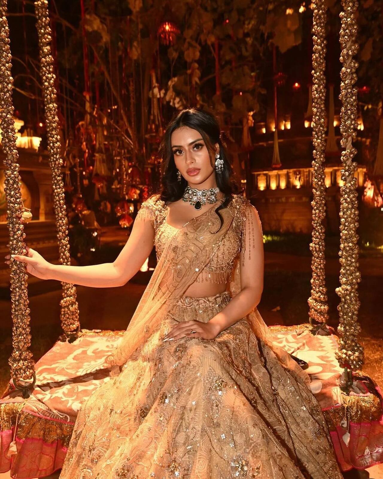In this royal appearance, Nysa Devgan shines in a heavily embellished golden lehenga that features intricate zardosi work and shimmering sequins.&nbsp;