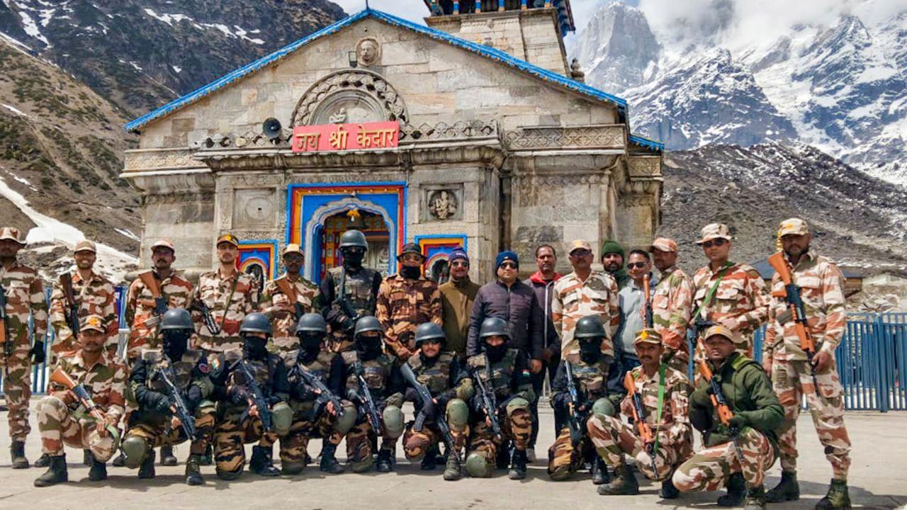 Security personnel, including the Anti Terrorist Squad (ATS), pose ahead of the ceremony, ensuring safety arrangements for the large number of expected pilgrims.