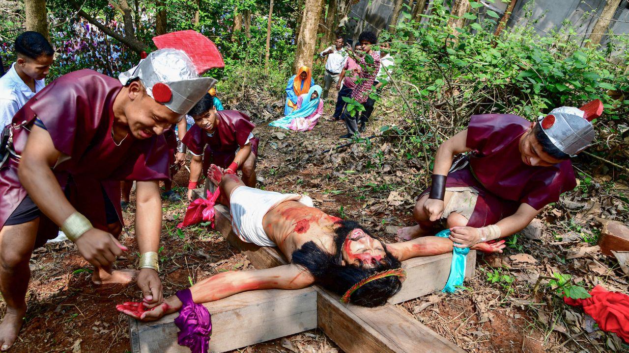 Participants stage a reenactment of Jesus Christ's crucifixion on the occassion of Good Friday, in Guwahati