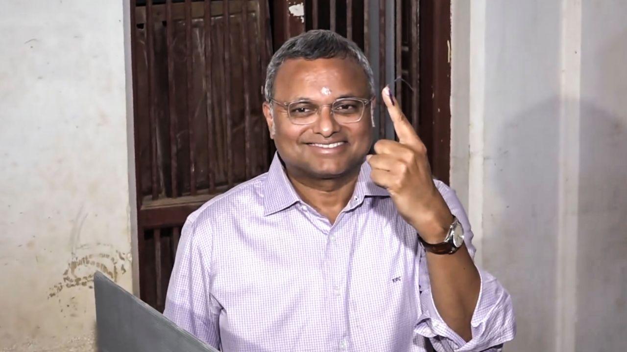 Congress MP Karti Chidambaram shows his ink-marked finger after casting his vote for the Tamil Nadu Assembly elections, in Sivaganga district