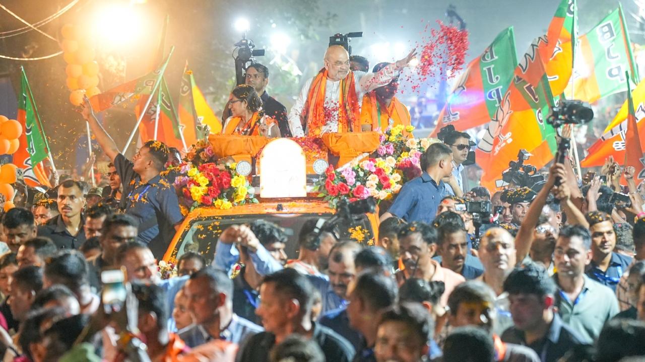 Shah, along with BJP candidate Roopa Ganguly and other leaders, waved from atop a decorated truck covered with saffron hues as people lined up along both sides of the road in the congested town located in South 24 Parganas district.