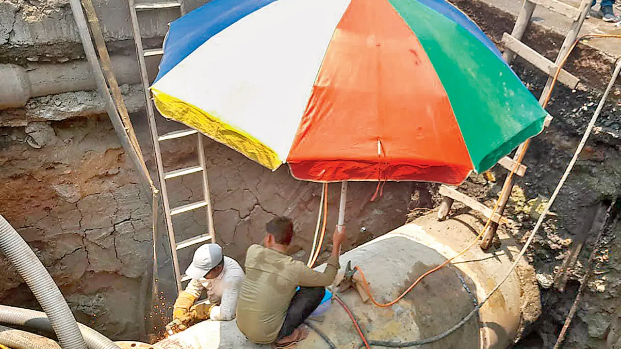 Civic workers carry out work along Haji Bunder Road in Sewri on Wednesday. PICS/BY SPECIAL ARRANGEMENT