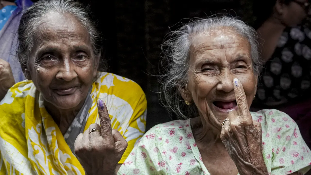 Elderly women show their ink-marked fingers after casting votes in the final phase of the West Bengal Assembly Elections, at a polling station in Kolkata on Wednesday. PIC/PTI