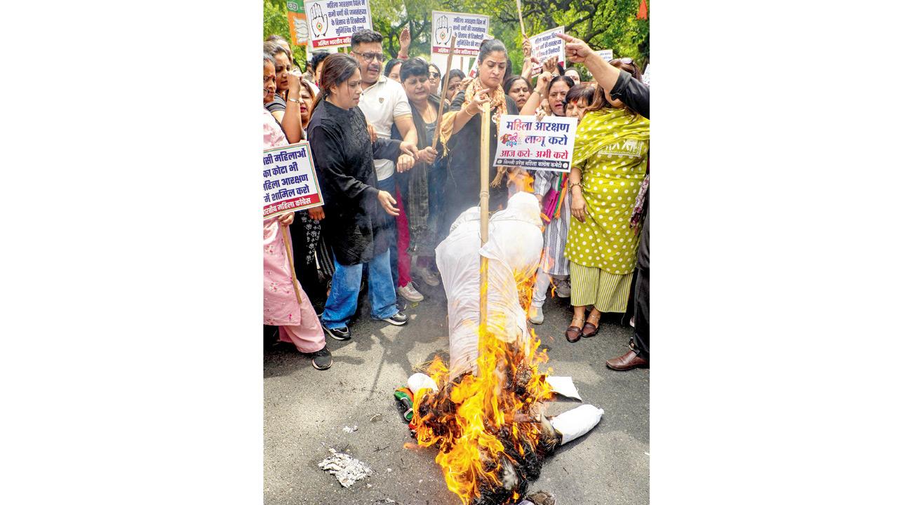 Delhi Congress members protest outside BJP office. PIC/PTI