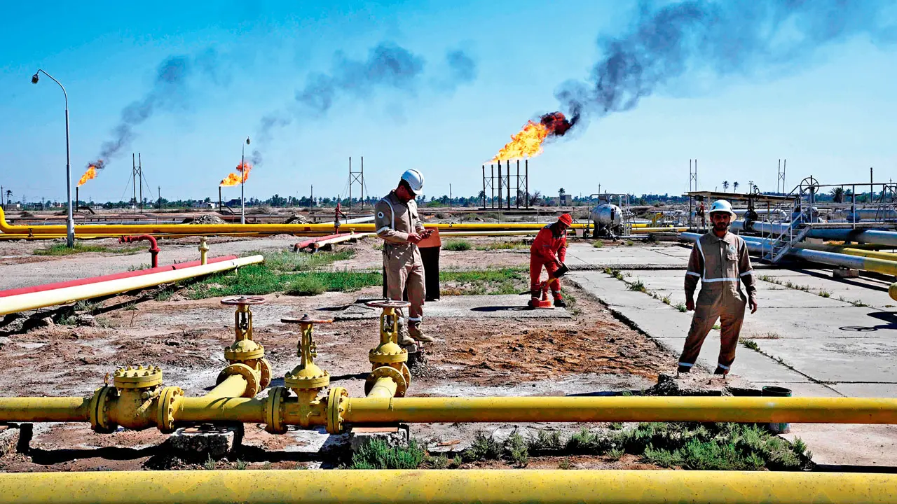Employees of Basra Oil Company, work at the Nahr Bin Umar Oil and Gas Field on the outskirts of the southern Iraqi city of Basra on Wednesday; Baghdad said it had reached understandings with the US and Iran to reduce the impact of the Hormuz blockade on Iraqi oil exports. Pic/AFP