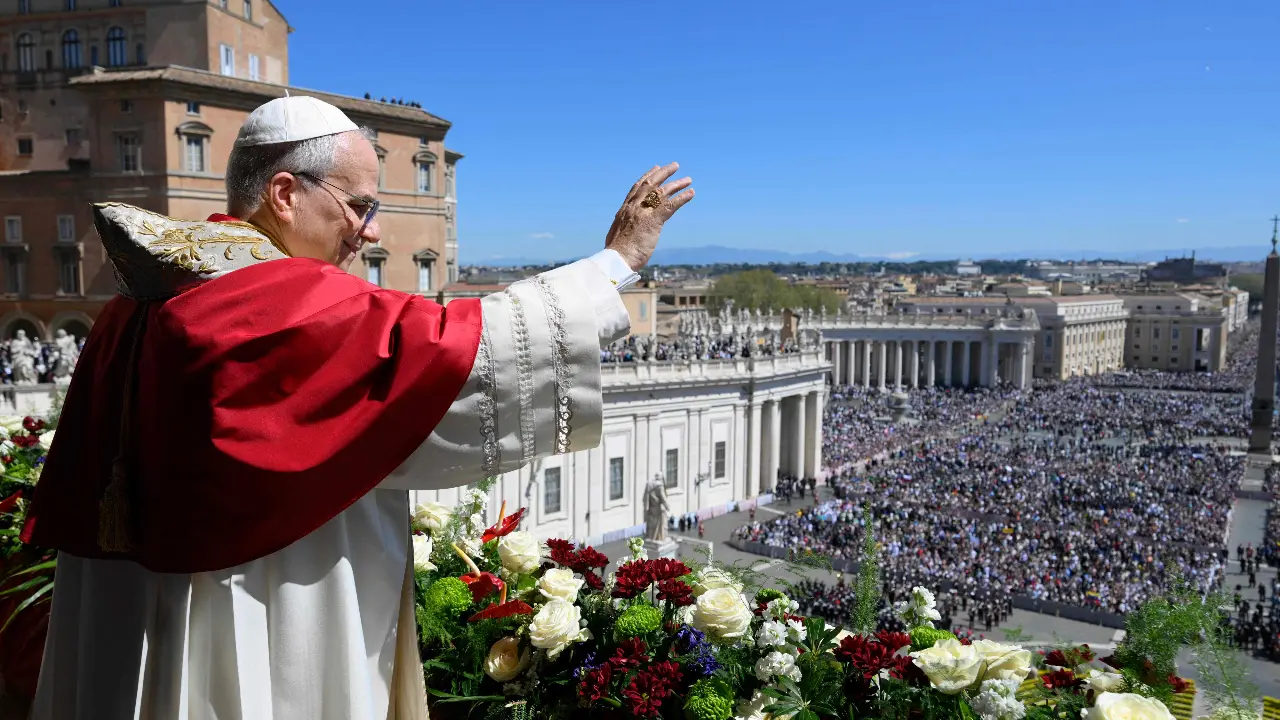 Pope Leo XIV addresses the crowd from the main balcony of St. Peter's basilica for the Urbi et Orbi message and blessing to the city and the world as part of Easter celebrations in The Vatican. Photo: AFP Photo/Vatican Media