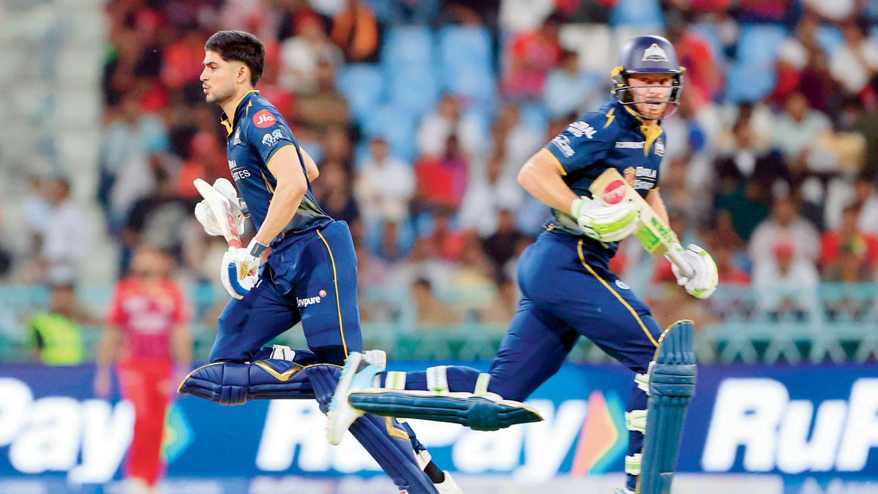 GT skipper Shubman Gill (left) and Jos Buttler during their 84-run stand