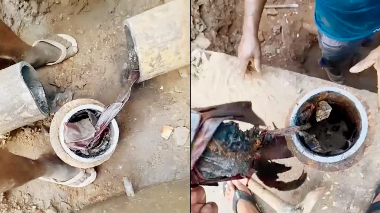 Civic workers clean a pipeline to address the water woes of those residing between Shefali bus stop and Vale in Gorai. Pics/By Special Arrangement