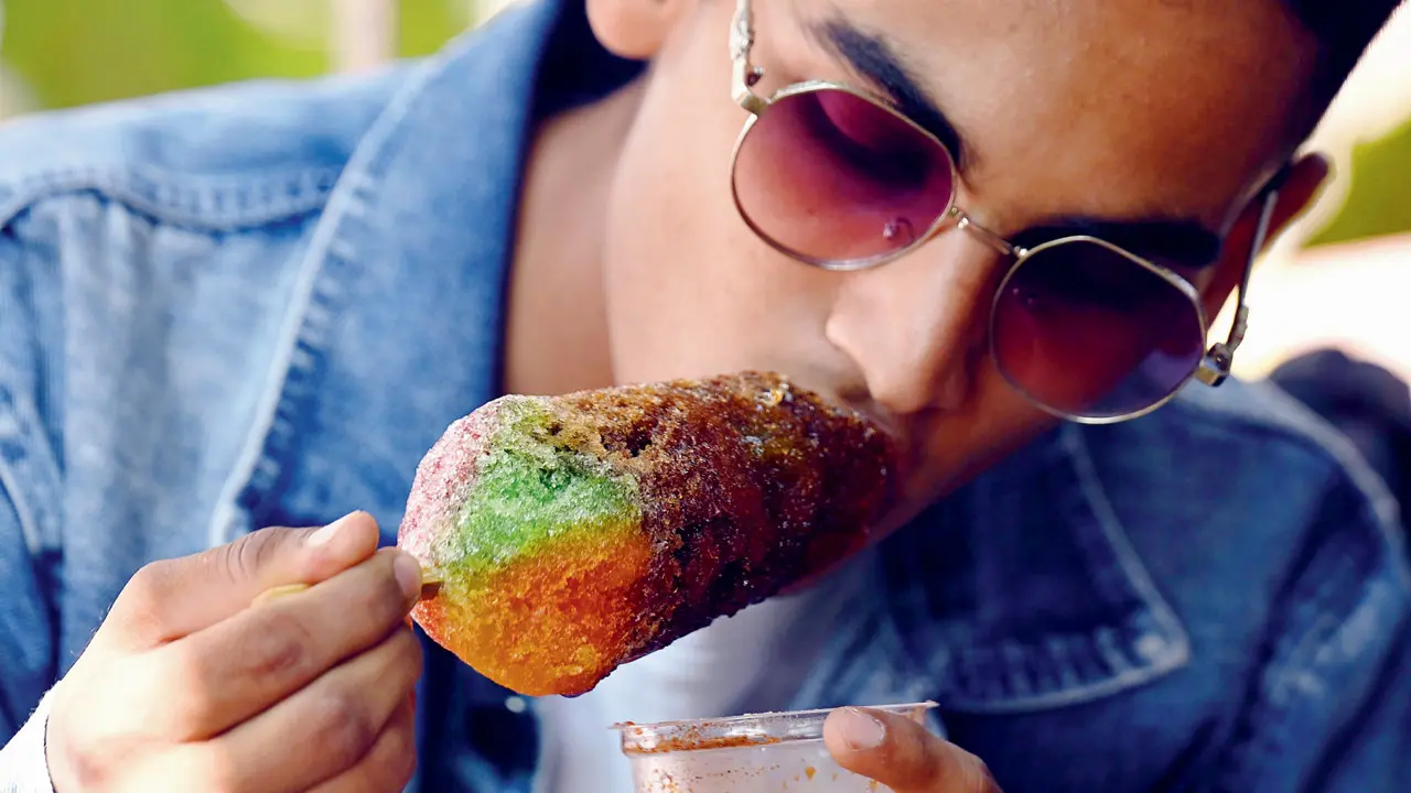 A boy cools down with an ice gola at Girgaon Chowpatty, a popular summer treat amid rising temperatures
 